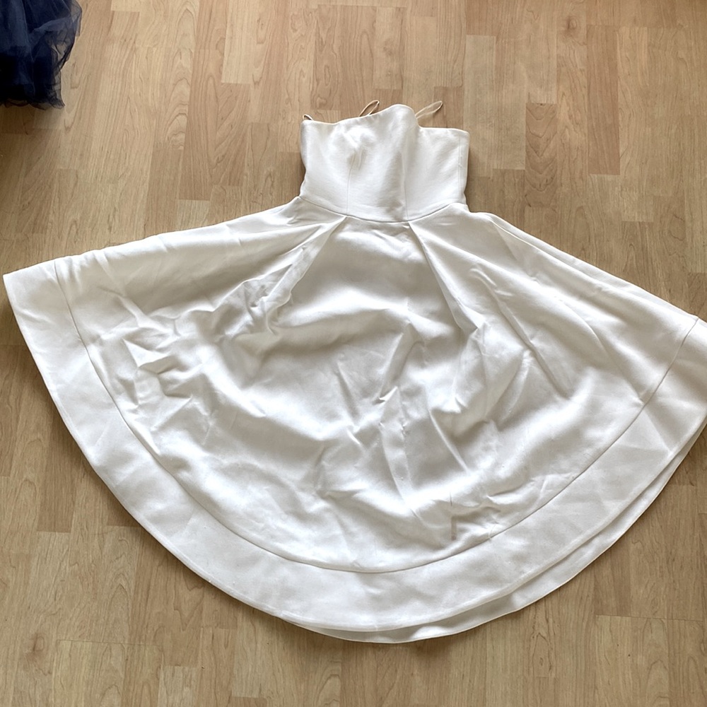 Cream sleeveless wedding or formal tea-length dress